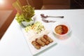 Vietnamese Food in Restaurant white plate on the Table with side dish, Ingredients of Vietnamese Wraps or Pork Sausage, Nam Naung Royalty Free Stock Photo