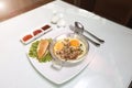 Vietnamese Food in Restaurant white plate on the Table with side dish, style fried egg in pan with white pork sausage, Chinese Royalty Free Stock Photo