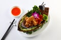 Vietnamese fried spring rolls on bamboo tray with sliced cucumber, salad and chili sauce Royalty Free Stock Photo