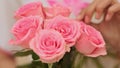 Vietnamese girl holding a bouquet of pink roses