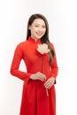 Vietnamese girl holding a lotus flower, The Ao dai  long-dress Vietnamese is traditional costume of Vietnamese woman Royalty Free Stock Photo