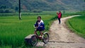 Vietnamese girl riding bicycle on track