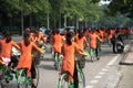 Vietnamese girls wear traditional long dress Ao Dai cycling on Hanoi street Royalty Free Stock Photo