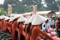 Vietnamese girls wear traditional long dress Ao Dai cycling on Hanoi street