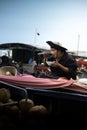 Vietnamese on his boat eating noodles at the floating market