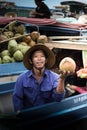 Vietnamese on his boat selling coconut at the floating market