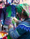 Vietnamese Hmong minority woman trying new traditional costume