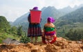 Vietnamese Hmong women standing on the side of a mountain pass