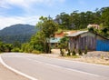 Vietnamese house in the mountains with a nearby mountain road Royalty Free Stock Photo