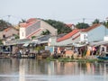 Vietnamese houses on a river, floating market and boats, traditional way of life, Hoi An town, central Vietnam