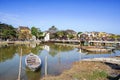 Vietnamese houses on a river, floating market and boats, traditional way of life, Hoi An town, central Vietnam Royalty Free Stock Photo