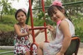 These are Vietnamese kids. They are very happy when their parents take them to outside