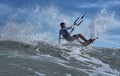 Vietnamese kite surfer jumps with kiteboard Royalty Free Stock Photo