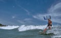 Vietnamese kite surfer jumps with kiteboard Royalty Free Stock Photo