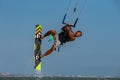 Vietnamese kite surfer jumps with kiteboard Royalty Free Stock Photo