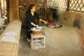 Vietnamese lady cooking tradional rice paper, Vietnam