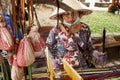 Vietnamese lady weaver working on a loom