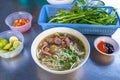 Vietnamese local food- Pho beef noodles soup served with vegetables Royalty Free Stock Photo