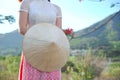 Vietnamese long dress with traditional leaf hat