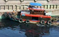 Vietnamese man anchorage boat polluted water