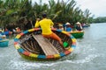 A Vietnamese man is dancing on basket boat Royalty Free Stock Photo