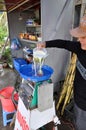 Vietnamese man making cane-juice from sugar cane for tourists Royalty Free Stock Photo