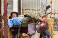 Vietnamese man sleeps on motorbike on street in My Tho, Vietnam