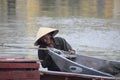 Vietnamese Man with traditional boat