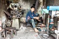 Vietnamese mechanic in his shop