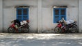 Vietnamese motorbike taxi driver sleeping on motorcycle