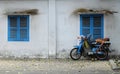 Vietnamese motorbike taxi driver sleeping on motorcycle