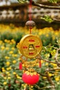 Vietnamese New Year decoration on a blurred background of yellow flowers.