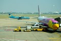 Vietnamese people loading baggage to store room of plane