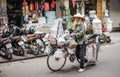 Vietnamese people often use cargo bikes to sell their goods on the streets of Hanoi Royalty Free Stock Photo