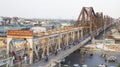 Vietnamese people riding motorcycles on Long Bien bridge Royalty Free Stock Photo