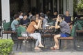 Vietnamese people sit in a street cafe in the center of the old city of Hanoi, Vietnam Royalty Free Stock Photo