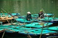 Vietnamese People sitting on Bamboo boat