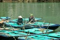 Vietnamese People sitting on Bamboo boat