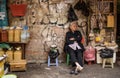 Vietnamese people wait to sell their products in a small street shop in Hanoi. Vietnam