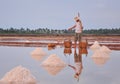 Vietnamese people working on the salt fields