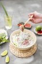 Vietnamese Pho Noodle Soup. Beef with Chilli, Basil, Rice Noodles, Bean Shoots showing noodles picked up with Chopsticks Royalty Free Stock Photo