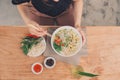 Vietnamese Pho Noodle Soup. Beef with Chilli, Basil, Rice Noodles, Bean Shoots showing noodles picked up with Chopsticks Royalty Free Stock Photo