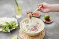 Vietnamese Pho Noodle Soup. Beef with Chilli, Basil, Rice Noodles, Bean Shoots showing noodles picked up with Chopsticks Royalty Free Stock Photo