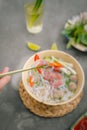 Vietnamese Pho Noodle Soup. Beef with Chilli, Basil, Rice Noodles, Bean Shoots showing noodles picked up with Chopsticks Royalty Free Stock Photo