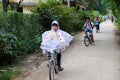 Vietnamese pupil ride bike from school