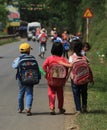 Vietnamese pupils going to school on a country road Royalty Free Stock Photo