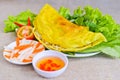 Vietnamese rice pancake with fish sauce, tomato and fermented ca