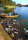 Vietnamese sanitation worker, rubbish, water, pollution Royalty Free Stock Photo