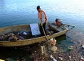 Vietnamese sanitation worker, rubbish, water, pollution Royalty Free Stock Photo