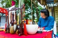 Vietnamese scholar writes calligraphy at lunar new year. Calligraphy festival is a popular tradition during Tet holiday. Text in p